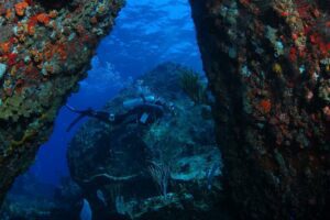 Diver Between Boulders - Scuba Diving the BVI